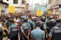 সোমবার রাজধানীর খিলখেত মোহাম্মদী ফ্যাশন সোয়েটার্স লিঃ এর শ্রমিকরা কারণ ছাড়া ফ্যাক্টরি বন্ধ করার প্রতিবাদে ও অবিলম্বে ফ্যাক্টরির তালা খুলে দেয়ার দাবিতে রাস্তা অবরোধ করে বিক্ষোভ করে - পিএনএস। 